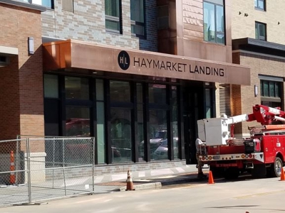 Exterior business signage for HAYMARKET LANDING Photo