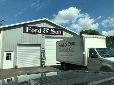 Ford & Son signage on the white warehouse Photo