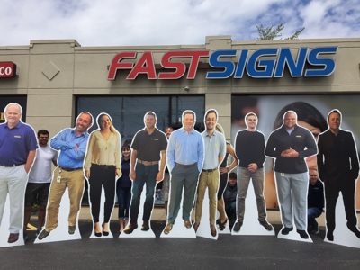 group of people holding the standees Photo