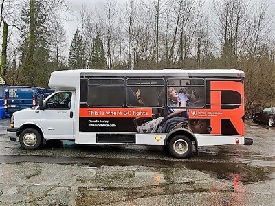 White truck with custom vehicle wrap Photo