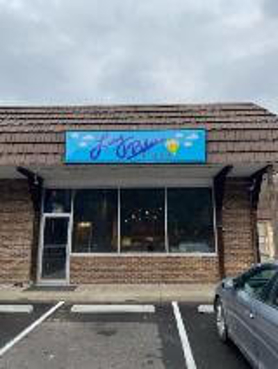 Blue-colored storefront signage Photo