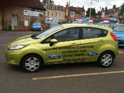 Yellow car with custom car wrap Photo