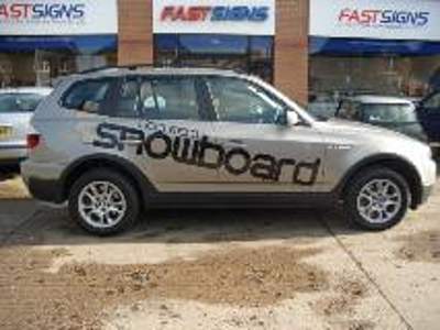 Car with snowboard word graphics Photo