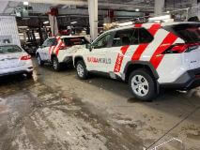 White car with red car wrap Photo