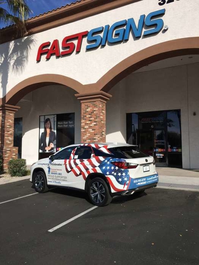 White car with custom car wrap Photo