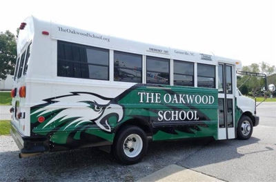 School service with custom vehicle wrap Photo