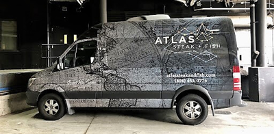 Van with custom vehicle wrap Photo