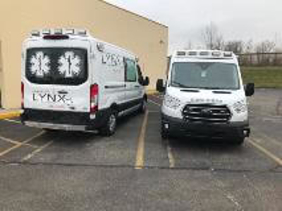 Ambulance with vehicle graphics Photo
