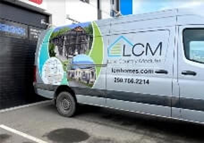 LCM lake country real estate management sign on the van Photo
