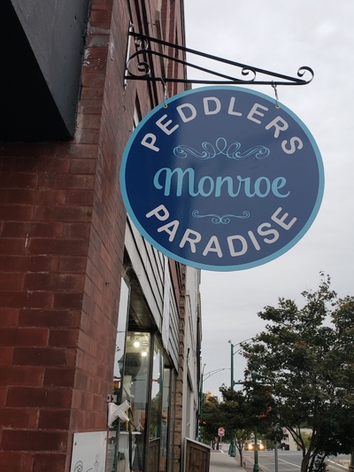 Business name hanging sign Photo
