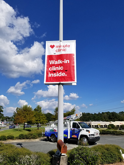 Minute Clinic banner on the pole Photo
