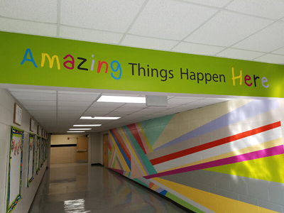Amazing  things happen here letters on the wall Photo