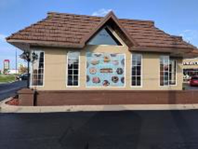 Rool and donuts graphics on the window Photo
