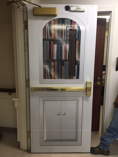 Door window with book graphics Photo