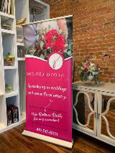 Pink signage standee with image Photo