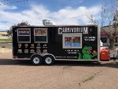 Carnivorium trailer truck parked Photo