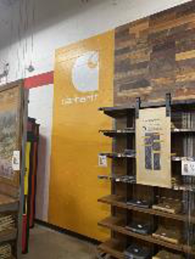 advertisement in yellow wall Photo