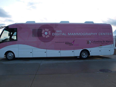 Bus wrapped with the color pink Photo