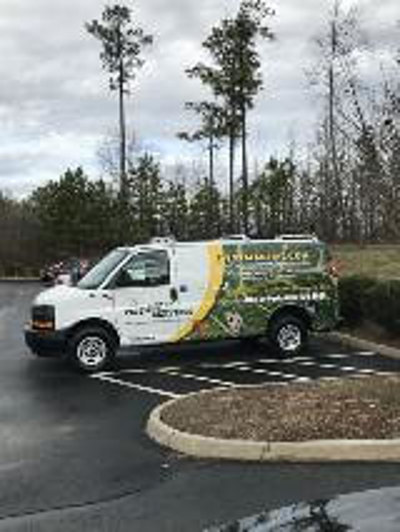 Pestmaster vehicle parked on a lot Photo