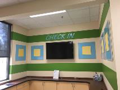 Check-in sign on the wall Photo