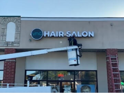 VNG Hair salon signage with a man Photo
