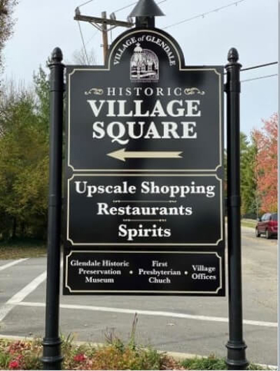 Village Square black signage Photo