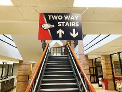 Two way stairs hanging sign Photo