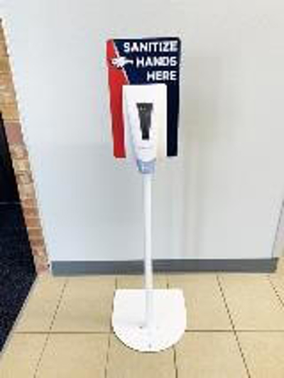 Sanitize hands signage on the wall Photo