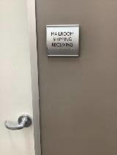 Mailroom shipping receiving sign Photo