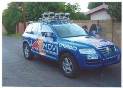 Blue car wrap with graphics Photo