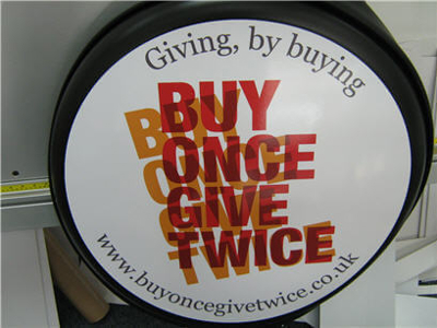 Giving by buying logo Photo