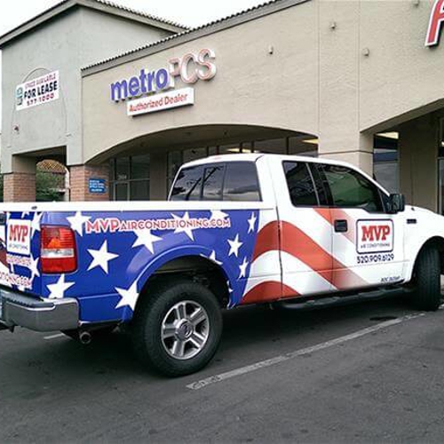 White pickup with custom vehicle wrap