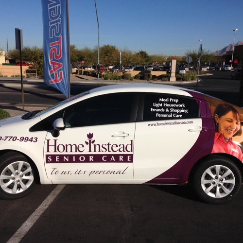 White car with custom vehicle wrap