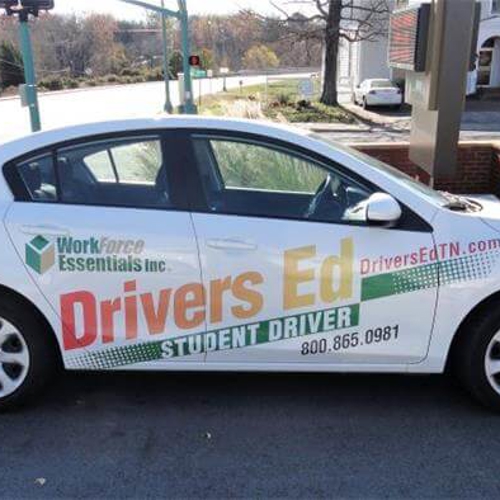 White car with custom vehicle graphics
