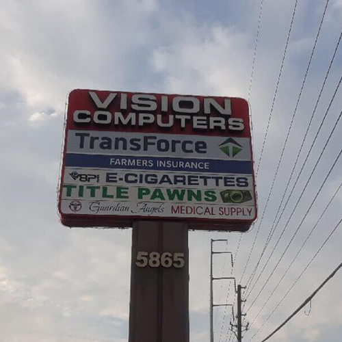 Different business names on the pylon pole with number address