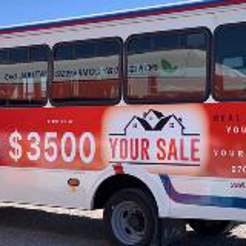 Vehicle wrap with graphics parked on a parking lot