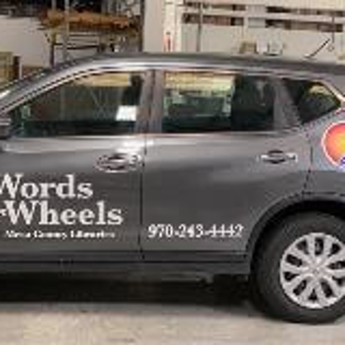 Vehicle wrap with words and wheel letters