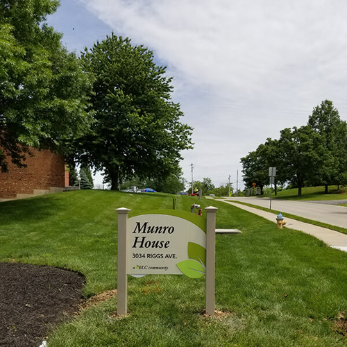 green and white Munro house signage