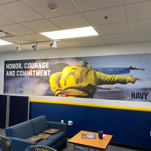 Navy office with wall mural of a solider