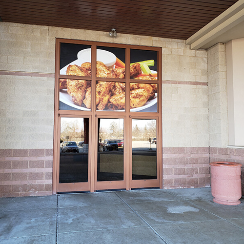 Food image on the glass window of the building