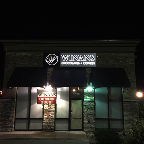 Winans Custom signage on a close store