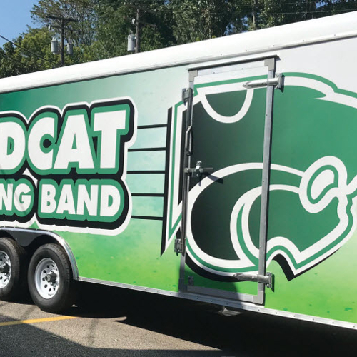 Vehicle wrapped with wildcat marching brand graphics