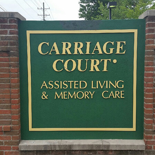 Carriage court outside signage with brick column design