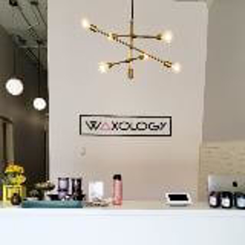 Waxology custom decal on the reception are with things on the table