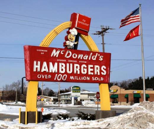 An image of the old McDonald's signage with their golden arch