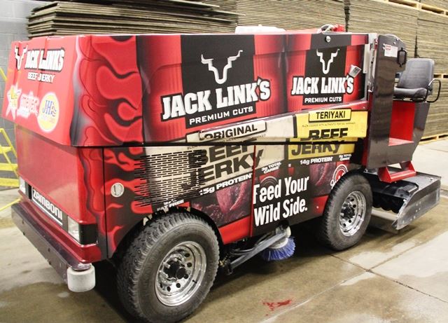 A zamboni is covered in vinyl wrap decorated with Jack Link's beef jerky
