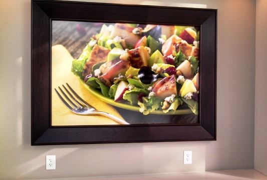 A framed picture of a salad