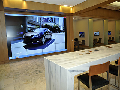 A Lexus dealership uses many different screens to either make one large picture or many small pictures