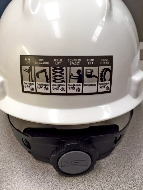 A decal is placed on a construction helmet to provide information