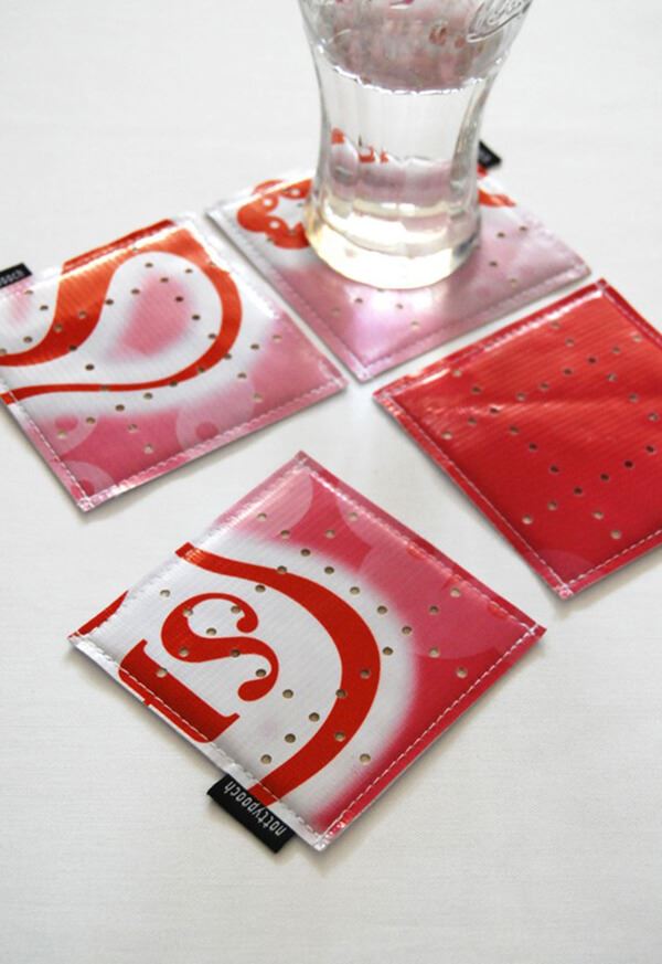 Old marketing materials are upcycled and used as coasters